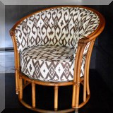F11. On of a pair of vintage rattan chairs upholstered in white and brown Quadrille fabric. 